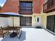 Private courtyard with patio furniture and view of the home's exterior and balconies at 8114 Oak Trace Way # C, Tampa, FL 33634