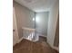 Carpeted staircase with white railing leads to the upper level of the home at 8114 Oak Trace Way # C, Tampa, FL 33634