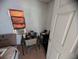Small room featuring a window, desk, and basic furnishings at 3613 Deleuil Ave, Tampa, FL 33610