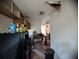 Kitchen view showcasing damage to the ceiling and featuring dark cabinets with a countertop at 3613 Deleuil Ave, Tampa, FL 33610