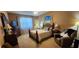 Inviting bedroom featuring a large window, comfortable chair, and beach-themed decor at 7620 Tangle Rush Dr, Gibsonton, FL 33534