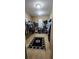 Walk-in closet featuring shelving units for organized storage space and carpeted floor at 7620 Tangle Rush Dr, Gibsonton, FL 33534
