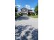 Charming two-story home features a manicured lawn, two-car garage, and warm curb appeal at 7620 Tangle Rush Dr, Gibsonton, FL 33534
