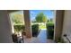 Charming front porch with tiled flooring and lush greenery in the background at 7620 Tangle Rush Dr, Gibsonton, FL 33534