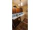 Convenient laundry room with front load machines, granite counters, tiled backsplash, and ample upper cabinet storage at 7620 Tangle Rush Dr, Gibsonton, FL 33534