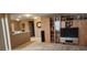 Open loft area with neutral carpet, built-in shelving, and plenty of space at 7620 Tangle Rush Dr, Gibsonton, FL 33534