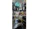 Organized pantry with wire shelving and a variety of food items and small appliances for convenient storage at 7620 Tangle Rush Dr, Gibsonton, FL 33534