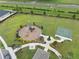 Aerial view of a community park with playground, basketball court, and walking paths at 7163 Talamore Dr, Wesley Chapel, FL 33545