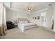 Bright main bedroom with neutral tones, upholstered bed frame, and ample natural light at 7163 Talamore Dr, Wesley Chapel, FL 33545