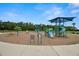 Community playground with slides, swings, and shaded play areas for children to enjoy at 7163 Talamore Dr, Wesley Chapel, FL 33545