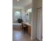 Bathroom with double sinks, vanity, bathtub, and neutral tiles throughout at 10937 Bluestem Cir, Lakewood Ranch, FL 34202