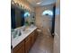 Well-lit bathroom features a vanity, decorative accents, and updated fixtures at 10937 Bluestem Cir, Lakewood Ranch, FL 34202