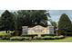 Stone sign for Riverwalk Meadow with manicured landscaping and mature trees creating an inviting entrance at 10937 Bluestem Cir, Lakewood Ranch, FL 34202