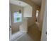 Upstairs hallway with stairway, natural light, and neutral color scheme at 10937 Bluestem Cir, Lakewood Ranch, FL 34202