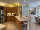 Kitchen featuring a breakfast bar, stainless steel appliances, and ample counter space at 10937 Bluestem Cir, Lakewood Ranch, FL 34202