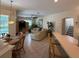 A Gathering room that boasts natural light from the nearby view to the pool and leads to the staircase at 10937 Bluestem Cir, Lakewood Ranch, FL 34202