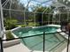 Enclosed pool with lush landscaping and a -proof fence at 10937 Bluestem Cir, Lakewood Ranch, FL 34202