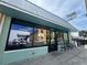 Storefront with 'Coffee, Pastries, Books, Gifts, Art & More' text on the windows at 11955 Sylvia St, Dade City, FL 33525