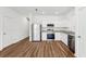 Open concept kitchen with stainless steel appliances, granite counters, and eat in space at 11957 Sylvia St, Dade City, FL 33525