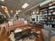 Inviting bookstore interior with comfortable seating, including a sofa and shelves filled with books at 11975 Sylvia St, Dade City, FL 33525