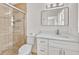 Bathroom featuring walk-in shower with updated fixtures and a white vanity with solid surface countertop at 1764 Boca Raton Ct, Punta Gorda, FL 33950