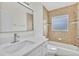 Bathroom with a solid surface vanity and a tub-shower combo at 1764 Boca Raton Ct, Punta Gorda, FL 33950