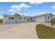 Single-story home featuring a spacious driveway and attached two-car garage at 1764 Boca Raton Ct, Punta Gorda, FL 33950