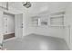 Bright garage features painted floor, built-in shelving, and an automatic garage door opener at 1764 Boca Raton Ct, Punta Gorda, FL 33950