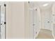 Hallway with neutral flooring, closet and access to rooms at 1764 Boca Raton Ct, Punta Gorda, FL 33950
