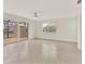 Open living space with tile flooring, a fan, and sliding glass doors leading to a patio at 1764 Boca Raton Ct, Punta Gorda, FL 33950