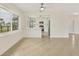 Bright living area with tile floors and a view into the updated kitchen at 1764 Boca Raton Ct, Punta Gorda, FL 33950