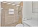 Updated shower with stylish tile and frameless glass door, complemented by modern fixtures and hardware at 1764 Boca Raton Ct, Punta Gorda, FL 33950