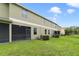 Spacious backyard with screened-in patio, offering a relaxing outdoor space at 20214 Water Hickory Pl, Tampa, FL 33647