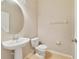 Half bathroom features pedestal sink and tile flooring at 20214 Water Hickory Pl, Tampa, FL 33647