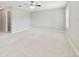 Expansive bedroom with light walls, plush carpet, and a ceiling fan at 20214 Water Hickory Pl, Tampa, FL 33647
