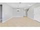 Open living area with tile flooring and chandelier at 20214 Water Hickory Pl, Tampa, FL 33647