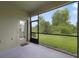Enclosed lanai with screened window and doorway to backyard at 20214 Water Hickory Pl, Tampa, FL 33647