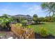 Backyard with enclosed pool, beautiful garden, and privacy fence at 2421 Valkaria Ave, North Port, FL 34286
