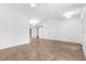 Spacious bedroom features tile floors, a ceiling fan, and a sliding barn door at 2421 Valkaria Ave, North Port, FL 34286