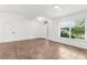 Spacious room boasts tile flooring, natural light, and a minimalist aesthetic at 2421 Valkaria Ave, North Port, FL 34286