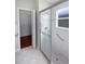 Bathroom with a glass shower door, grab bars, and tile flooring at 2936 Banyan Hill Ln, Land O Lakes, FL 34639