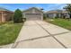 Beautiful single-story home with a well-manicured lawn and a spacious driveway at 2936 Banyan Hill Ln, Land O Lakes, FL 34639