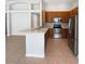 Kitchen with a peninsula, stainless steel appliances, ample wood cabinetry, and recessed lighting at 2936 Banyan Hill Ln, Land O Lakes, FL 34639