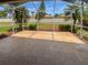 The screened lanai features brick pavers and views of the well-maintained backyard at 2936 Banyan Hill Ln, Land O Lakes, FL 34639