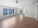 Spacious living room showcasing tile flooring and ample natural light at 2936 Banyan Hill Ln, Land O Lakes, FL 34639