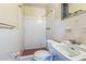 Full bath features white tile walls and a standard sink and toilet at 5101 Town N Country Blvd, Tampa, FL 33615