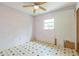 Bedroom features a ceiling fan and a single window at 5101 Town N Country Blvd, Tampa, FL 33615