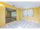 Bonus room featuring tile flooring and open view to main living areas at 5101 Town N Country Blvd, Tampa, FL 33615