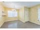 Inviting living room features neutral walls, tiled floor, natural lighting, and a chandelier at 5101 Town N Country Blvd, Tampa, FL 33615