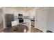 Eat-in kitchen with stainless steel appliances and white cabinetry at 6178 Daerr Ridge St, Zephyrhills, FL 33542